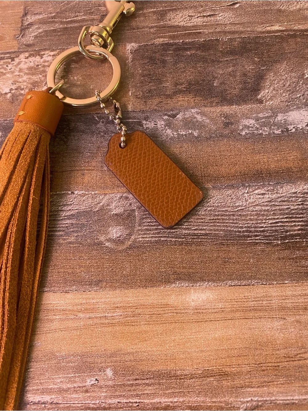 Coach Tan Leather Tassel Keychain with Gold Hardware
